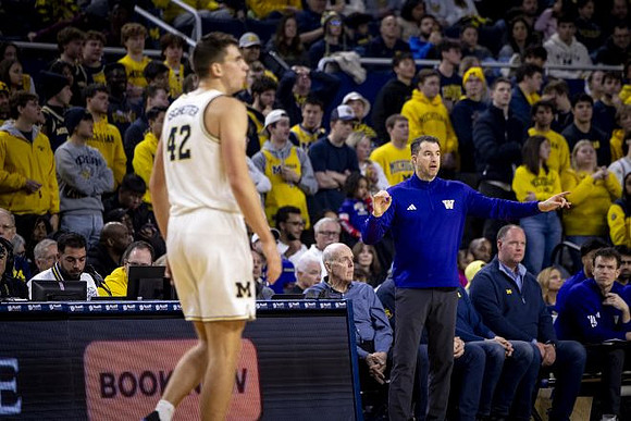 Will Tschetter (42) and Washington Head Coach Danny Sprinkle