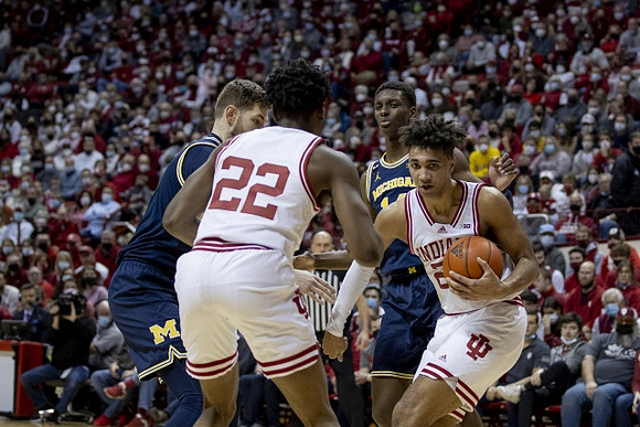 Hunter Dickinson (1) and Moussa Diabate (14)