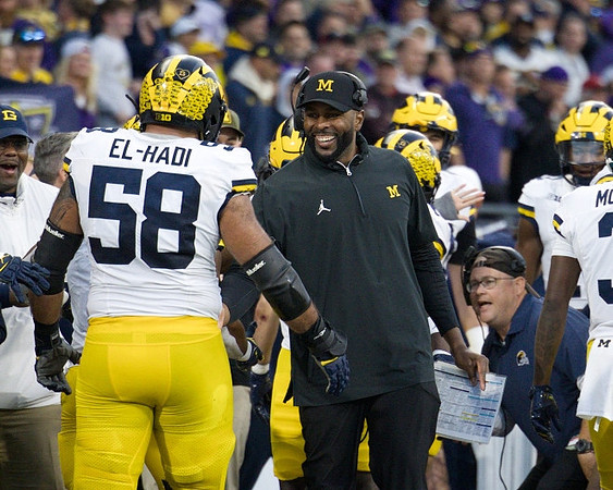 Giovanni El-Hadi (58) and Sherrone Moore
