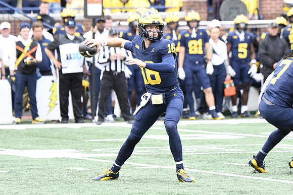 Davis Warren (16) and Donovan Edwards (7)