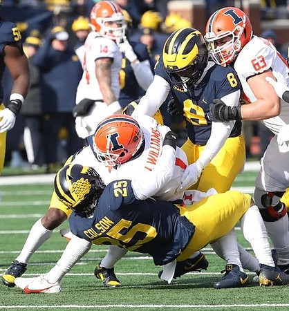 Junior Colson (25) and Derrick Moore (8)