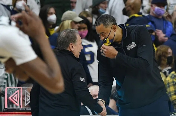 Michigan State Head Coach Tom Izzo and Juwan Howard