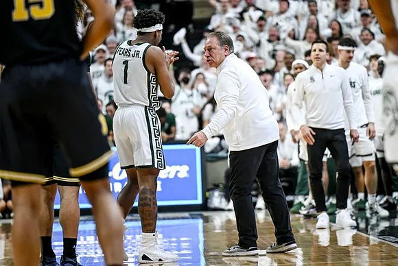 Rubin Jones (15) and Michigan State Head Coach Tom Izzo