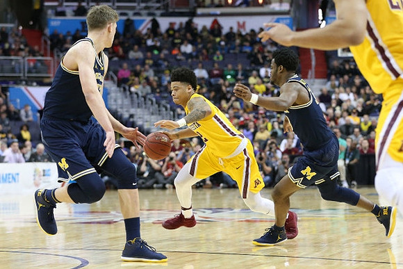 Moritz Wagner (13) and Derrick Walton Jr. (10)