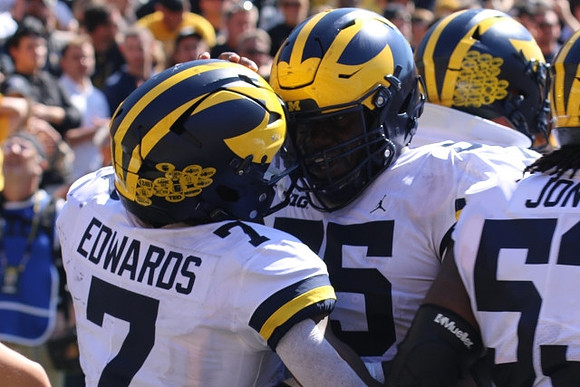 Donovan Edwards (7) and Olusegun Oluwatimi (55)