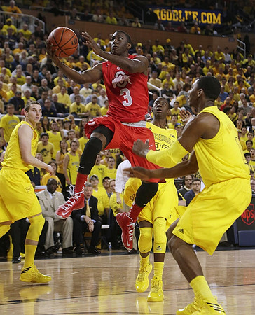 Nik Stauskas (11), Caris LeVert (23), and Glenn Robinson III (1)