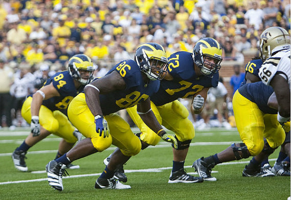 Steve Watson (84), Kevin Koger (86), Mark Huyge (72), and Denard Robinson (16)