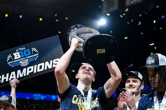 Will Tschetter (42), Rubin Jones (15), and Big Ten Tournament Championship Trophy