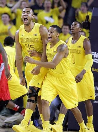 Jon Horford (15), Trey Burke (3), and Glenn Robinson III (1)