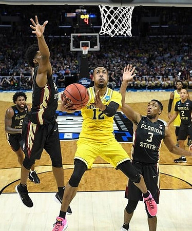 Muhammad-Ali Abdur-Rahkman (12) and Zavier Simpson (3)