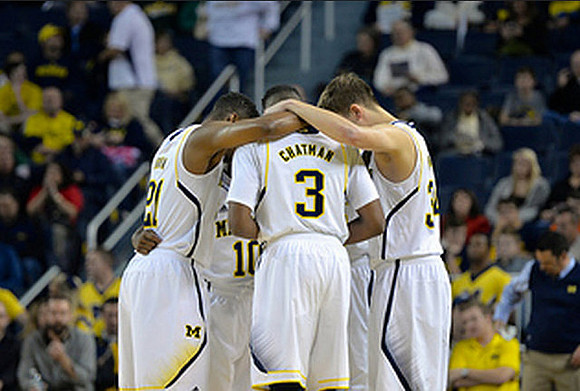 Zak Irvin (21), Kameron Chatman (3), and Mark Donnal (34)