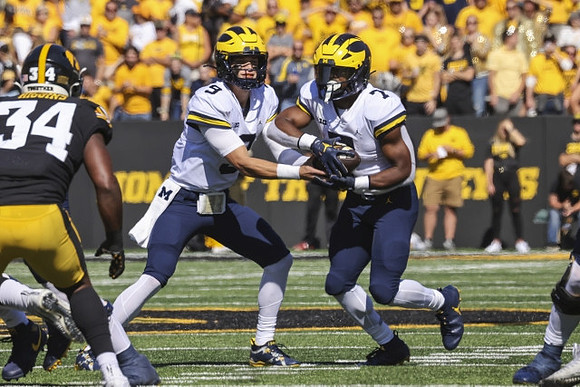 J.J. McCarthy (9) and Donovan Edwards (7)