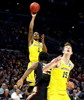 Charles Matthews (1) and Jon Teske (15)