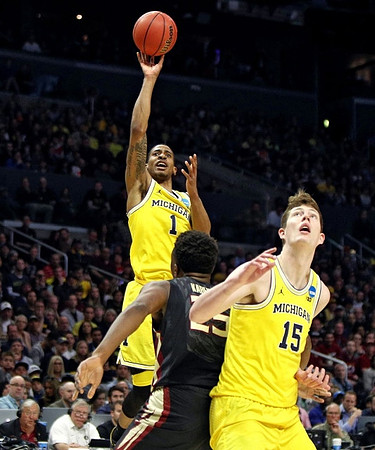 Charles Matthews (1) and Jon Teske (15)