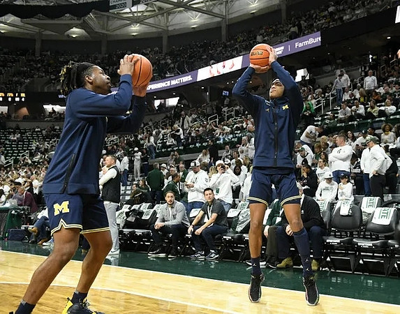 Gregg Glenn III (23) and Jett Howard (13)