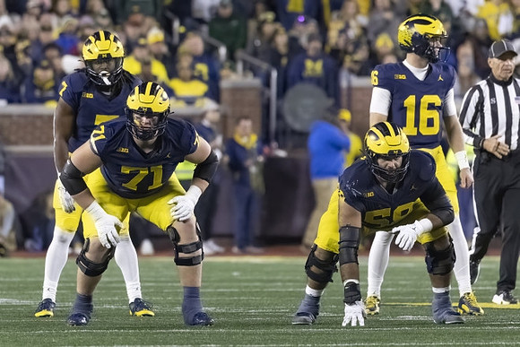 Donovan Edwards (7), Evan Link (71), Giovanni El-Hadi (58), and Davis Warren (16)