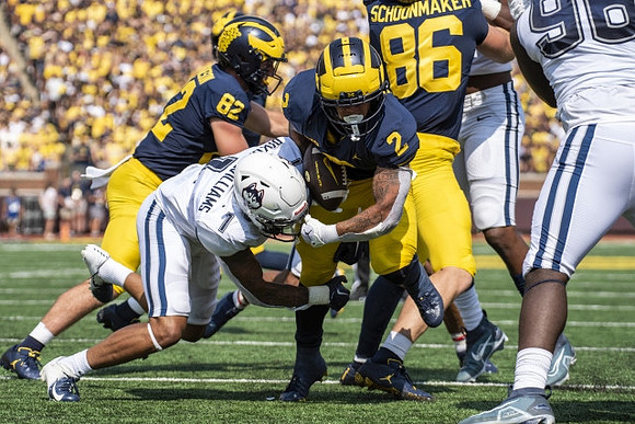 Max Bredeson (82), Blake Corum (2), and Luke Schoonmaker (86)