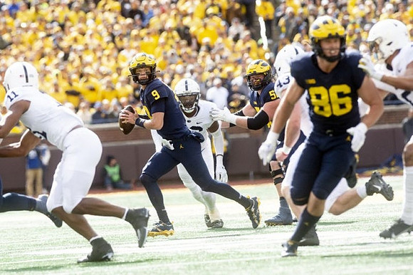 J.J. McCarthy (9), Karsen Barnhart (52), and Luke Schoonmaker (86)