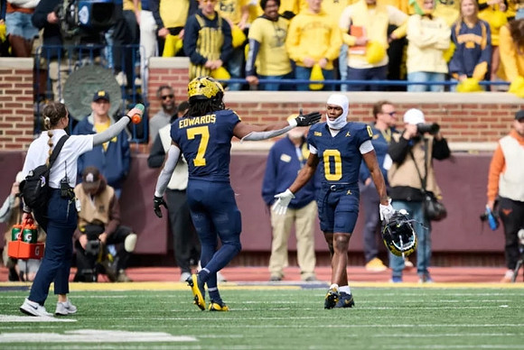 Donovan Edwards (7) and Semaj Morgan (0)