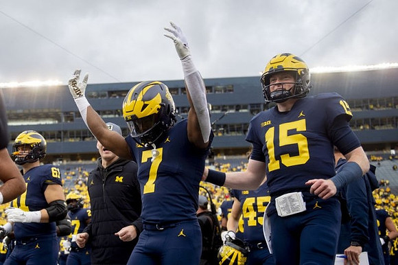 Noah Stewart (61), Donovan Edwards (7), and Alan Bowman (15)