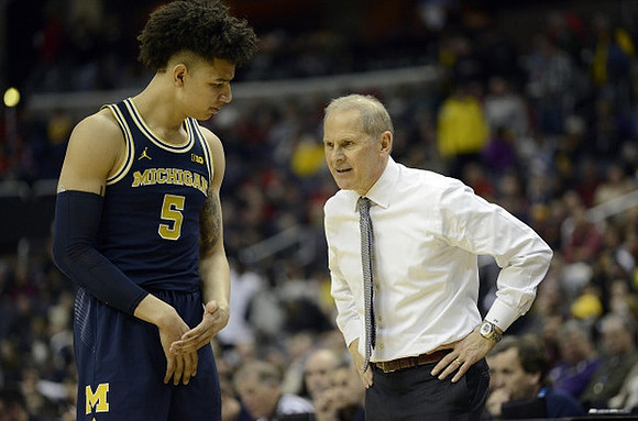 D.J. Wilson (5) and John Beilein