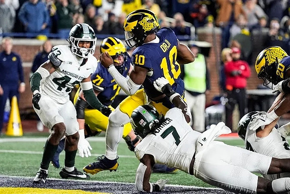 Evan Link (71), Alex Orji (10), and Kalel Mullings (20)