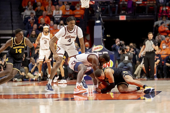 Moussa Diabate (14) and DeVante' Jones (12)