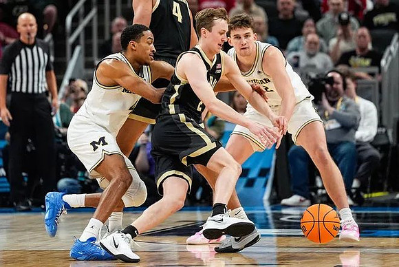 Nimari Burnett (4) and Will Tschetter (42)