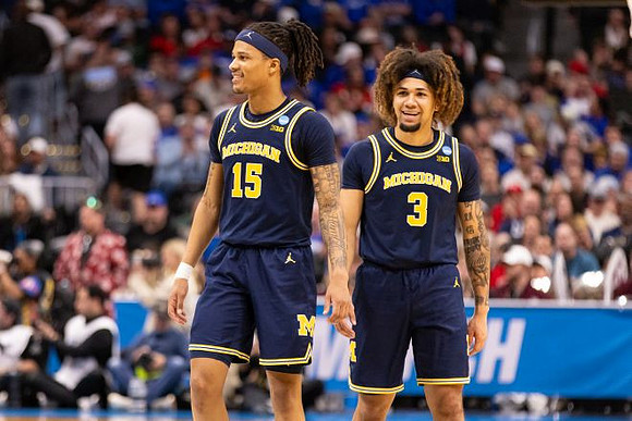 Rubin Jones (15) and Tre Donaldson (3)