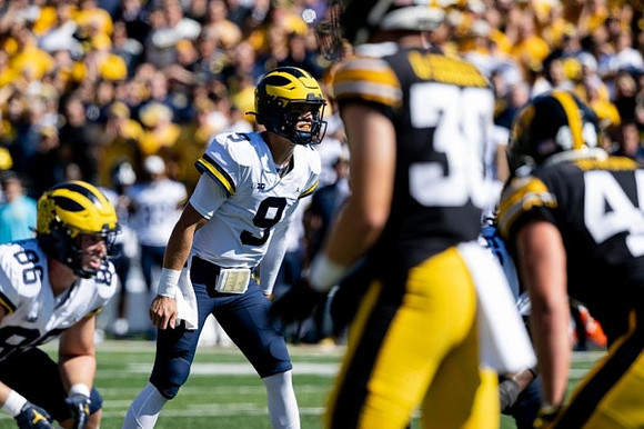 Luke Schoonmaker (86) and J.J. McCarthy (9)