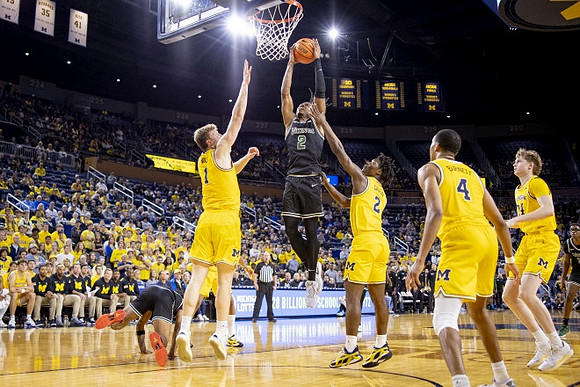 Danny Wolf (1), L.J. Cason (2), Nimari Burnett (4), and Sam Walters (24)