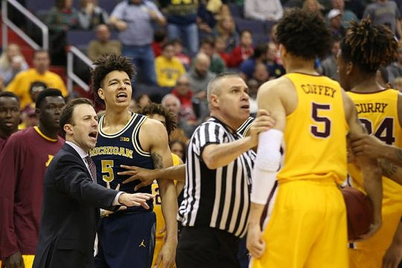 Minnesota Head Coach Richard Pitino and D.J. Wilson (5)