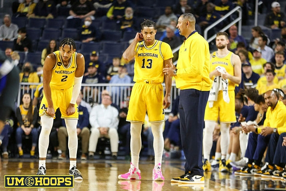 Kobe Bufkin (2), Jett Howard (13), Juwan Howard, Hunter Dickinson (1), and Saddi Washington