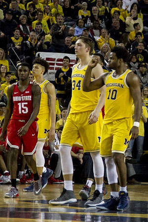 D.J. Wilson (5), Mark Donnal (34), and Derrick Walton Jr. (10)