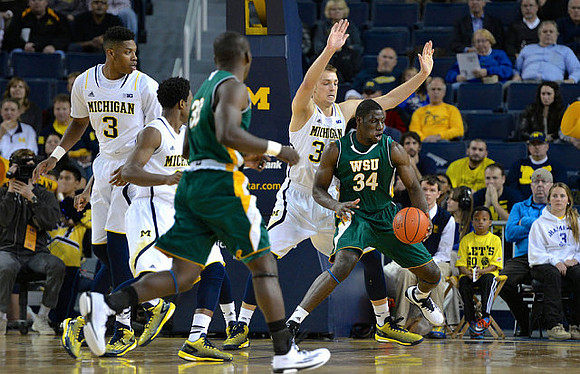 Kameron Chatman (3), Zak Irvin (21), and Mark Donnal (34)