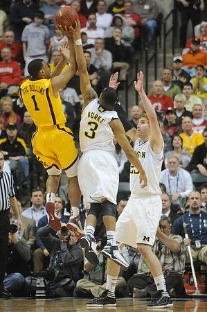 Trey Burke (3) and Evan Smotrycz (23)