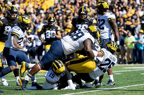 Michael Barrett (23), Mazi Smith (58), Rod Moore (19), Junior Colson (25), and Jaylen Harrell (32)