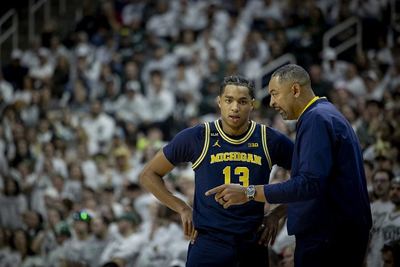 Jett Howard (13) and Juwan Howard