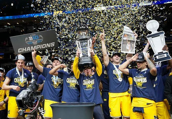 Dusty May, Michigan Team, and Big Ten Tournament Championship Trophy