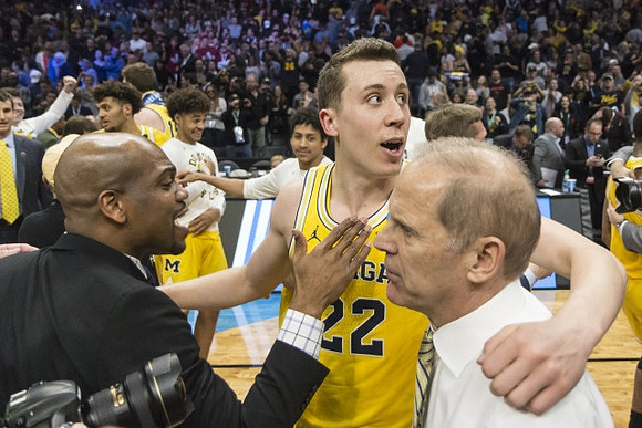 Duncan Robinson (22), John Beilein, Michigan Team, and Zavier Simpson (3)