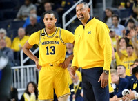 Jett Howard (13) and Juwan Howard