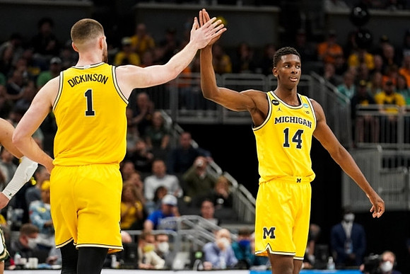 Hunter Dickinson (1) and Moussa Diabate (14)
