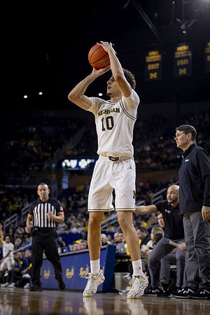 Justin Pippen (10) and Purdue-Fort Wayne Head Coach Jon Coffman