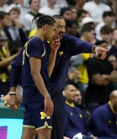 Jett Howard (13) and Juwan Howard