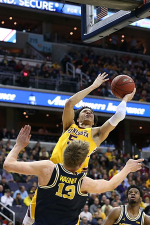Moritz Wagner (13) and Derrick Walton Jr. (10)
