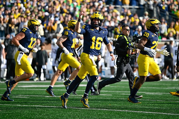 Marlin Klein (17), Colston Loveland (18), Davis Warren (16), and Kalel Mullings (20)