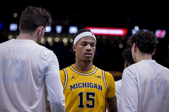 Rubin Jones (15) and Michigan Team