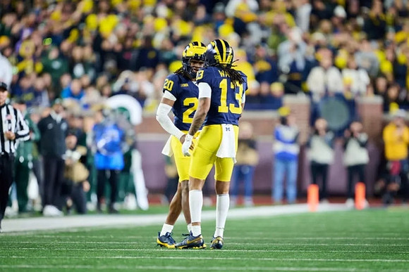 Jyaire Hill (20) and Wesley Walker (13)