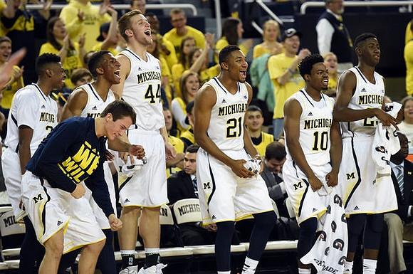 Andrew Dakich (11), Kameron Chatman (3), Aubrey Dawkins (24), Max Bielfeldt (44), Zak Irvin (21), Derrick Walton Jr. (10), and Caris LeVert (23)
