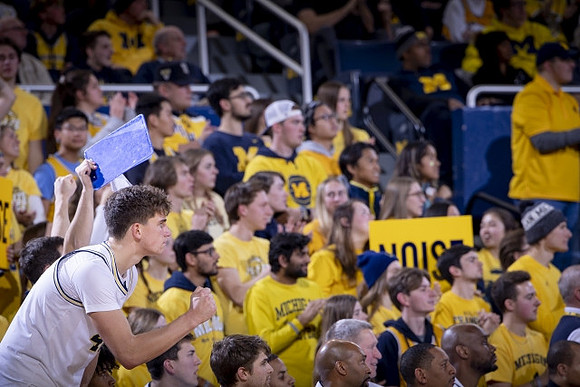 Joey Baker (15) and Michigan Team